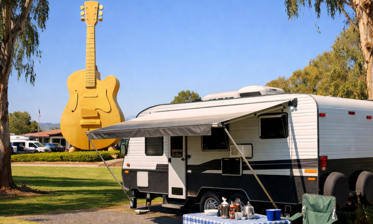Caravan at Tamworth holiday park with Big Golden Guitar in background