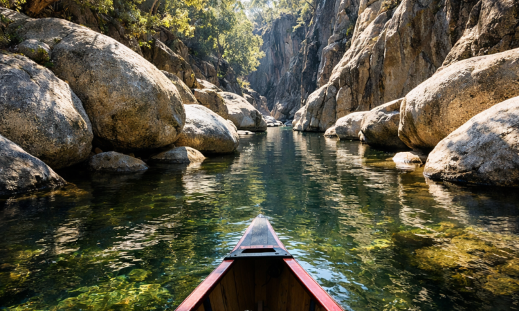 Canoe paddling through granite gorge on Namoi River in Warrabah National Park, New England NSW